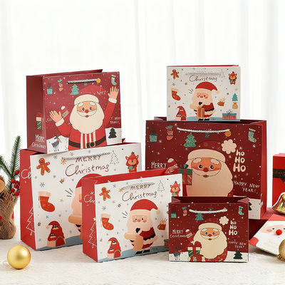 Τυπωμένα χριστουγεννιάτικα σάκοι Kraft Λοξοφόρα τσάντες δώρων με λαβή ταινίας